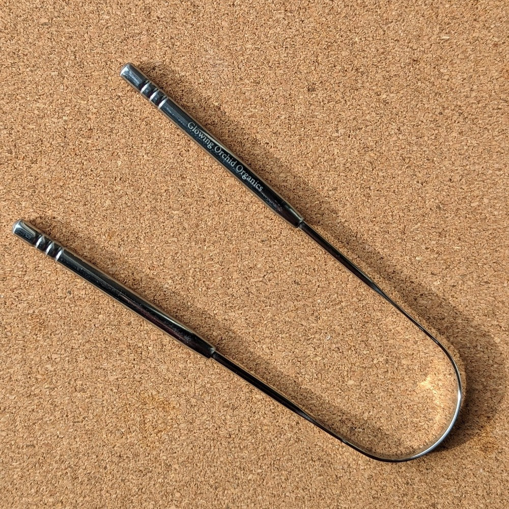 Tongue cleaner and scraper by glowing orchid stainless steel design