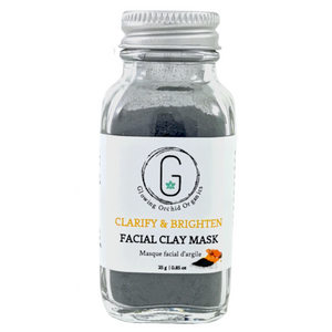 Charcoal & Turmeric (Clarifying & Brightening) Facial Clay Mask in Glass Bottle (40 g | 0.85 oz) Front Glowing Orchid Organics
