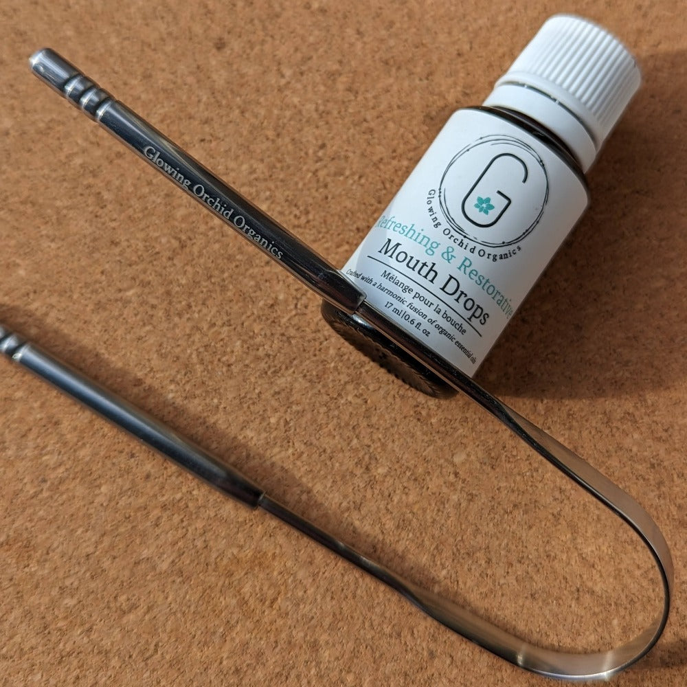 Tongue cleaner and scraper by glowing orchid stainless steel design with mouth drops restorative and refreshing