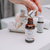 Evening Glow Facial Serum Glowing Orchid Organics 30 ml | 1.01 oz Vegan Cruelty Free with Pomegranate seed oil in Amber bottle with silver Dropper